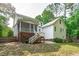 Home exterior features a spacious backyard with a deck and stairs at 188 Worthington Ct, Clayton, NC 27527