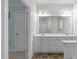 Bright bathroom featuring double sink vanity with lots of storage and a large mirror at 188 Worthington Ct, Clayton, NC 27527