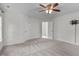 Spacious bedroom with neutral walls, ceiling fan, and carpet at 188 Worthington Ct, Clayton, NC 27527
