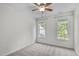 Sunlit bedroom with two windows offers carpet and a ceiling fan at 188 Worthington Ct, Clayton, NC 27527