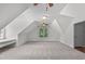 Large bonus room with a unique architecture, carpet, and natural light at 188 Worthington Ct, Clayton, NC 27527