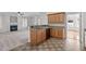 Well-lit kitchen featuring granite countertops, wooden cabinets, and stainless-steel appliances at 188 Worthington Ct, Clayton, NC 27527