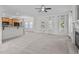 Spacious living room connected to kitchen with neutral carpet and fireplace at 188 Worthington Ct, Clayton, NC 27527