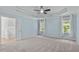 Tranquil main bedroom featuring a tray ceiling, plush carpet, and ensuite bathroom access at 188 Worthington Ct, Clayton, NC 27527