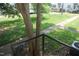 View of backyard with lush greenery, trees and patio with stairs leading down at 1908 Smallwood Dr, Raleigh, NC 27605