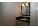Half bathroom featuring neutral color scheme, modern vanity, and lighting at 1908 Smallwood Dr, Raleigh, NC 27605