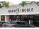 View of a Barnes & Noble exterior with ample parking and foliage around the entrance at 1908 Smallwood Dr, Raleigh, NC 27605