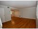 Bright living room featuring hardwood floors, light gray walls, and an open layout at 1908 Smallwood Dr, Raleigh, NC 27605