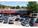 The storefronts of restaurants with customer parking on a sunny day at 1908 Smallwood Dr, Raleigh, NC 27605