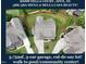 An aerial view highlights the home's roof, yard, and driveway and it's location in the neighborhood at 2100 Della Ct, Apex, NC 27502