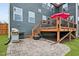 This backyard boasts a patio with a grill and a deck with outdoor seating, great for entertaining at 2100 Della Ct, Apex, NC 27502
