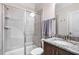 Bathroom featuring a glass shower stall, vanity with granite countertop, and a tile backsplash at 2100 Della Ct, Apex, NC 27502