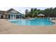 Community pool with water features and plenty of space for relaxation and recreation at 2100 Della Ct, Apex, NC 27502