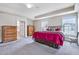 Expansive main bedroom suite with ample space, natural light, and room for seating area at 2100 Della Ct, Apex, NC 27502