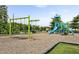 Community playground featuring slides and swing set for outdoor recreation and enjoyment at 2100 Della Ct, Apex, NC 27502