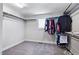 A walk-in closet with ample storage space offering organization for clothing and accessories at 2100 Della Ct, Apex, NC 27502