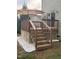 Backyard wood deck features steps and umbrella, great for outdoor relaxation and entertaining at 224 Swann Trl, Clayton, NC 27527
