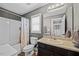 Neutral bathroom features a shower-tub combo with curtain and vanity with sink, providing comfort at 224 Swann Trl, Clayton, NC 27527