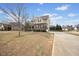 Charming two-story home with stone accents, manicured lawn, and a private driveway at 224 Swann Trl, Clayton, NC 27527