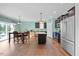 Open kitchen with an island, stainless steel appliances, and a dining area with natural light at 224 Swann Trl, Clayton, NC 27527