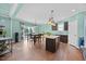Modern kitchen with granite countertops, a center island, and stainless steel appliances at 224 Swann Trl, Clayton, NC 27527