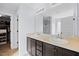 Well-lit main bathroom with dual vanity sinks, large mirrors, and a walk-in shower at 224 Swann Trl, Clayton, NC 27527