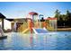 Outdoor splash pad featuring a colorful water play structure for Gathering fun at 224 Swann Trl, Clayton, NC 27527