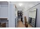 Organized walk-in closet with custom shelving, hanging racks, and mirrored accents at 224 Swann Trl, Clayton, NC 27527
