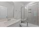 Bathroom with a glass enclosed shower, white cabinets and sink at 2329 Field Poppy Dr, Apex, NC 27502