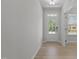 Inviting entryway with natural light streaming through the front door and adjacent windows at 2329 Field Poppy Dr, Apex, NC 27502