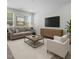 Living room with couch, tv, and chair at 2329 Field Poppy Dr, Apex, NC 27502