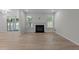 Bright living room with natural light, a fireplace, and access to an outdoor space at 2329 Field Poppy Dr, Apex, NC 27502