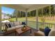 Relaxing screened-in porch with comfortable seating and a view of the backyard at 2329 Field Poppy Dr, Apex, NC 27502