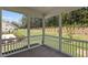 Screened-in porch overlooking a lush backyard and wooded area, great for outdoor relaxation at 2329 Field Poppy Dr, Apex, NC 27502