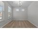 Spacious room featuring two windows bringing in natural light, and neutral walls at 2329 Field Poppy Dr, Apex, NC 27502