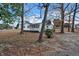 Charming home with a front porch, set among mature trees in the yard at 2400 Dorety Pl, Raleigh, NC 27604