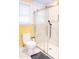 Updated bathroom with glass-enclosed shower and white marble tile at 250 Patterson Dr, Roxboro, NC 27573