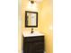 Bathroom vanity with a dark wood cabinet and a white countertop sink at 250 Patterson Dr, Roxboro, NC 27573
