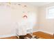 Bedroom with hardwood floors, rainbow wall decals, and white baby bed at 250 Patterson Dr, Roxboro, NC 27573