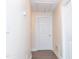 Hallway featuring updated flooring and white doors at 250 Patterson Dr, Roxboro, NC 27573