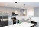 Updated kitchen featuring stainless steel appliances, gray cabinets and subway tile backsplash at 250 Patterson Dr, Roxboro, NC 27573