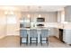 A newly renovated kitchen with stainless steel appliances, gray cabinets and white countertops at 250 Patterson Dr, Roxboro, NC 27573
