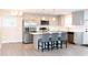 Modern kitchen with stainless steel appliances, quartz countertops, and island seating at 250 Patterson Dr, Roxboro, NC 27573
