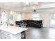 Spacious living room with new floors and a comfortable sectional sofa at 250 Patterson Dr, Roxboro, NC 27573