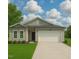 Charming single-story home with a two-car garage, landscaped yard, and neutral color palette at 284 Johnson Ridge Way, Four Oaks, NC 27524