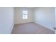 Bright bedroom with neutral carpet and a window for natural lighting at 285 Johnson Ridge Way, Four Oaks, NC 27524