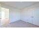 Spacious bedroom with neutral carpet, a double-door closet, and an entryway at 285 Johnson Ridge Way, Four Oaks, NC 27524