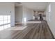 Spacious living room featuring hardwood floors and an open layout to the kitchen at 285 Johnson Ridge Way, Four Oaks, NC 27524