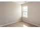 Bright bedroom features neutral walls, carpet, and a window for natural light at 296 Johnson Ridge Way, Four Oaks, NC 27524