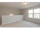 Carpeted bonus room featuring natural light, perfect for a playroom, office, or additional living space at 296 Johnson Ridge Way, Four Oaks, NC 27524